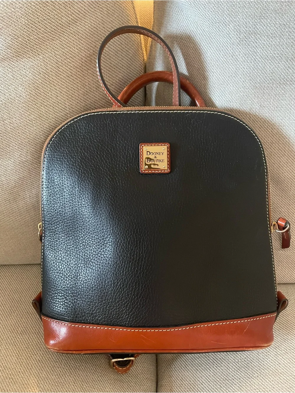 Dooney & Bourke Black with Brown Trim Leather Backpack